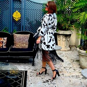 Super chic tassel wrap style dress. A total show stopper